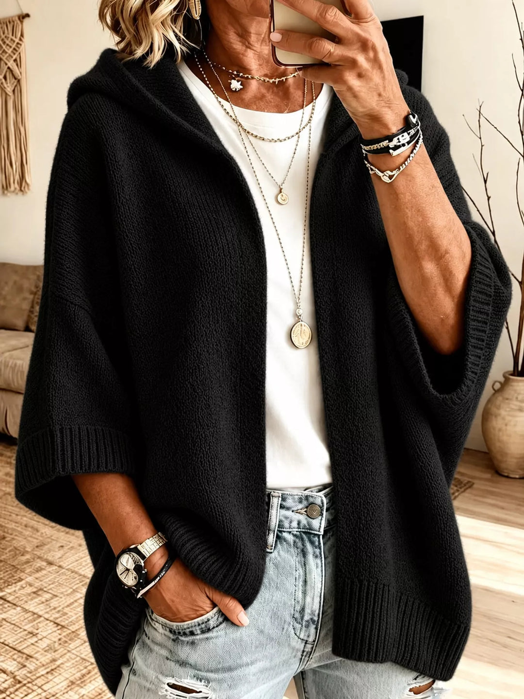 Hooded open front drop shoulder in black, styled on model