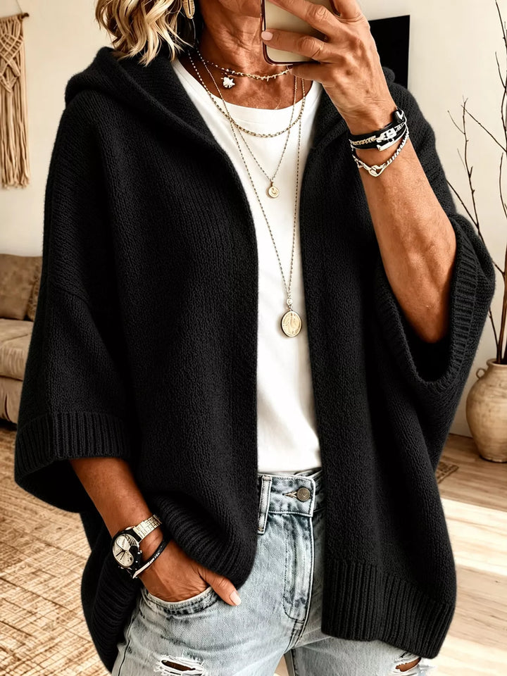 Hooded open front drop shoulder in black, styled on model