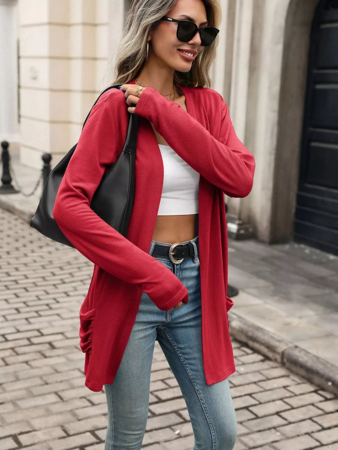 Open front waterfall drape thumbholes in red, styled on model 2