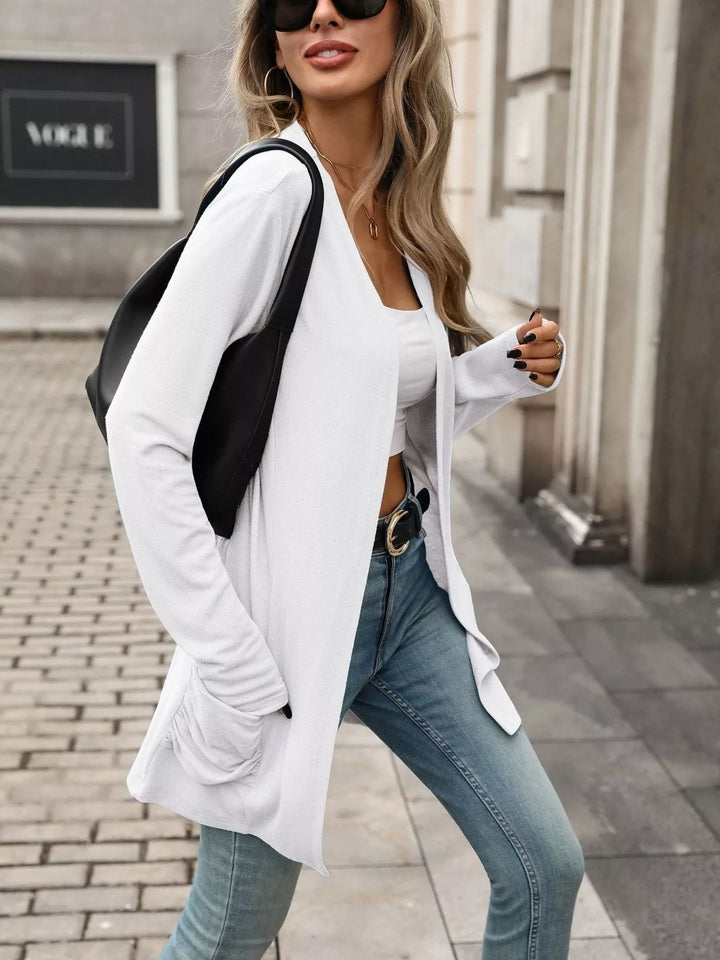 Open front waterfall drape thumbholes in white, styled on model
