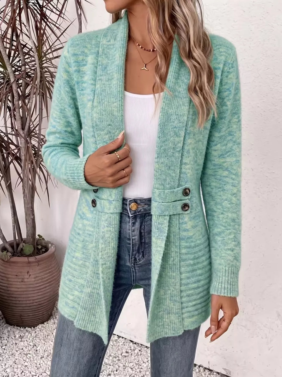 Shawl collar open front waist band in light green, styled on model