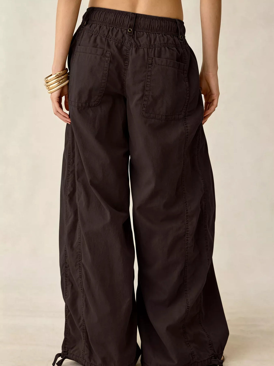 Back view of the espresso wide leg cargo pants with drawstring hem