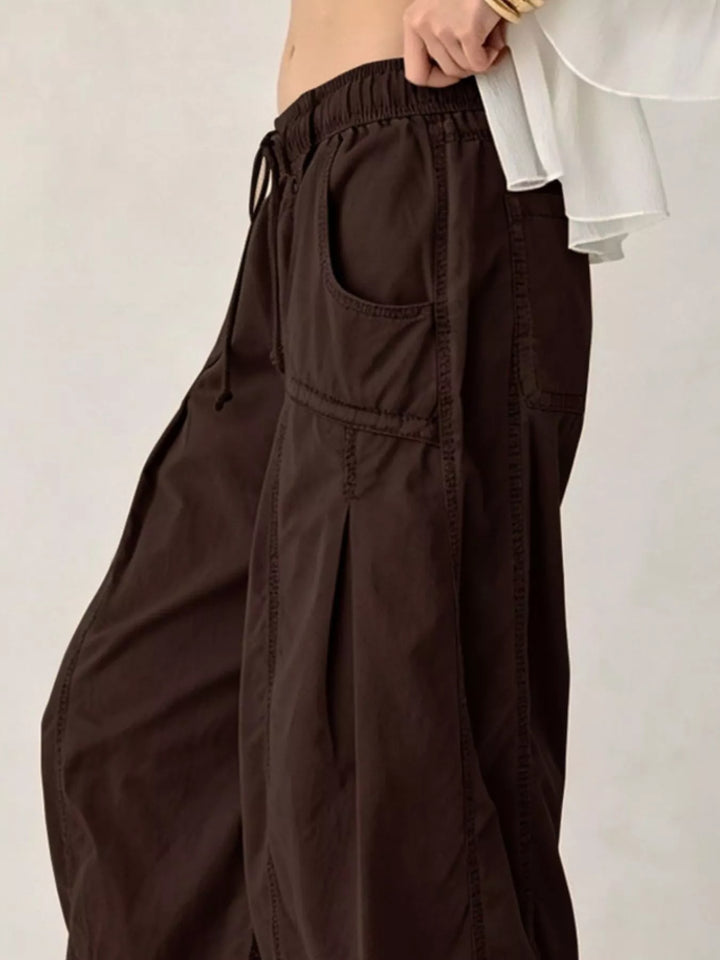 Espresso cargo pants in side view showing the roomy parachute leg
