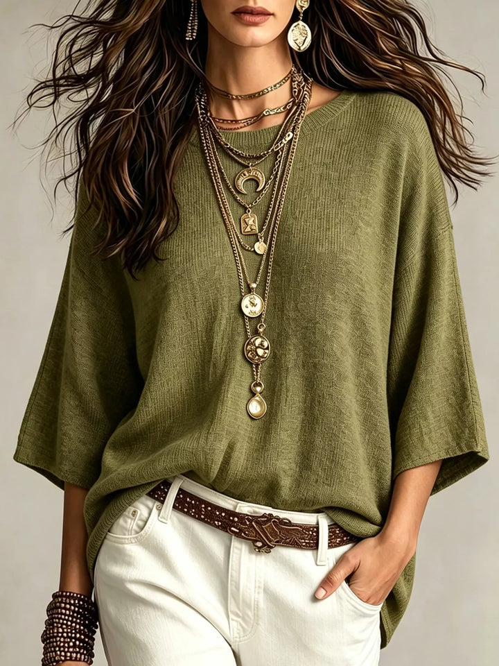 Olive green casual knit top with wide 3/4 sleeves and white pants