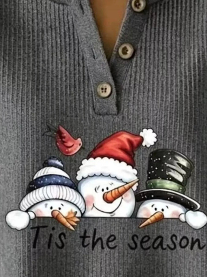 Snowman graphic henley placket in dark gray, close-up detail