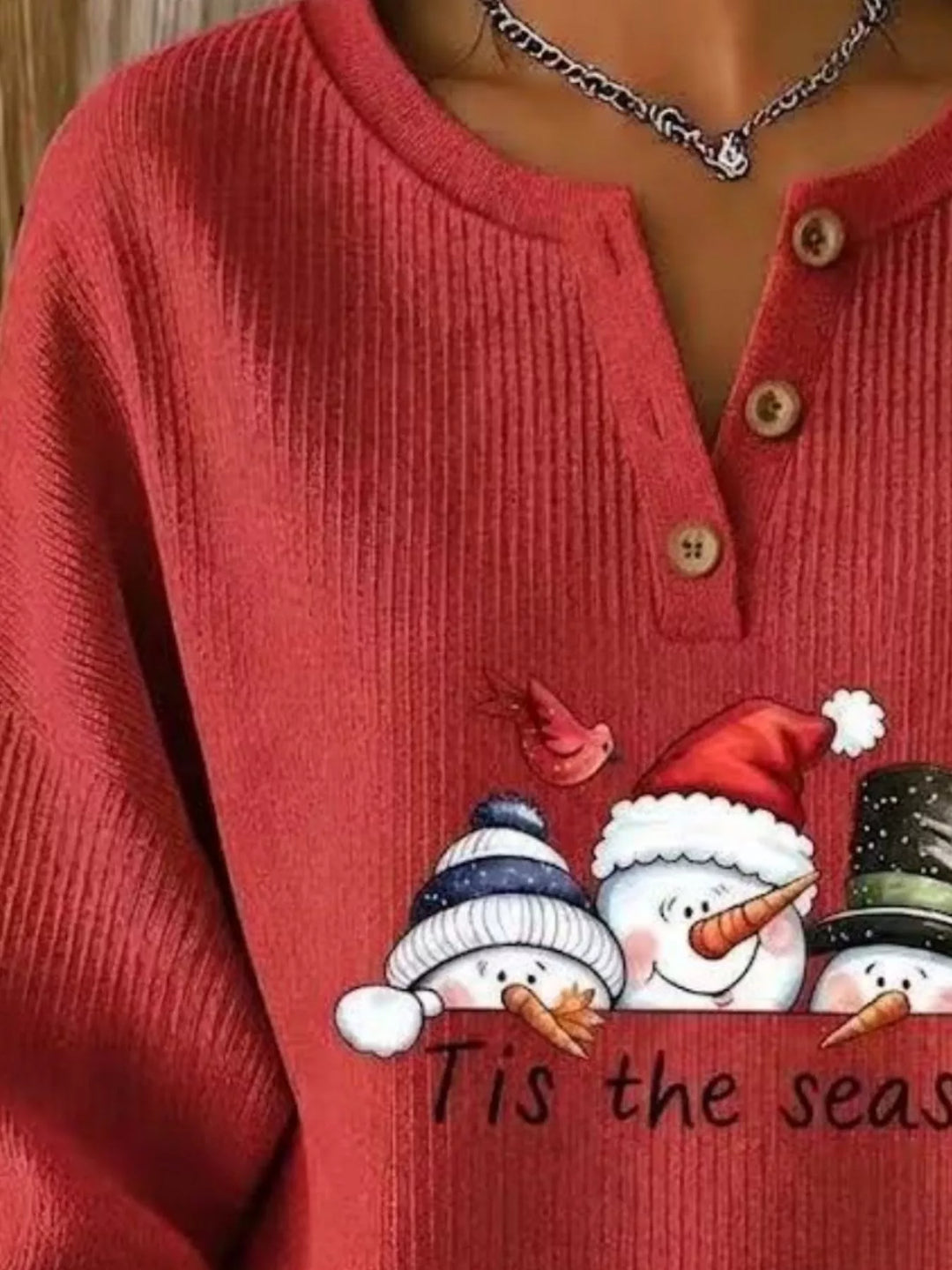 Snowman graphic henley placket in scarlet, close-up detail