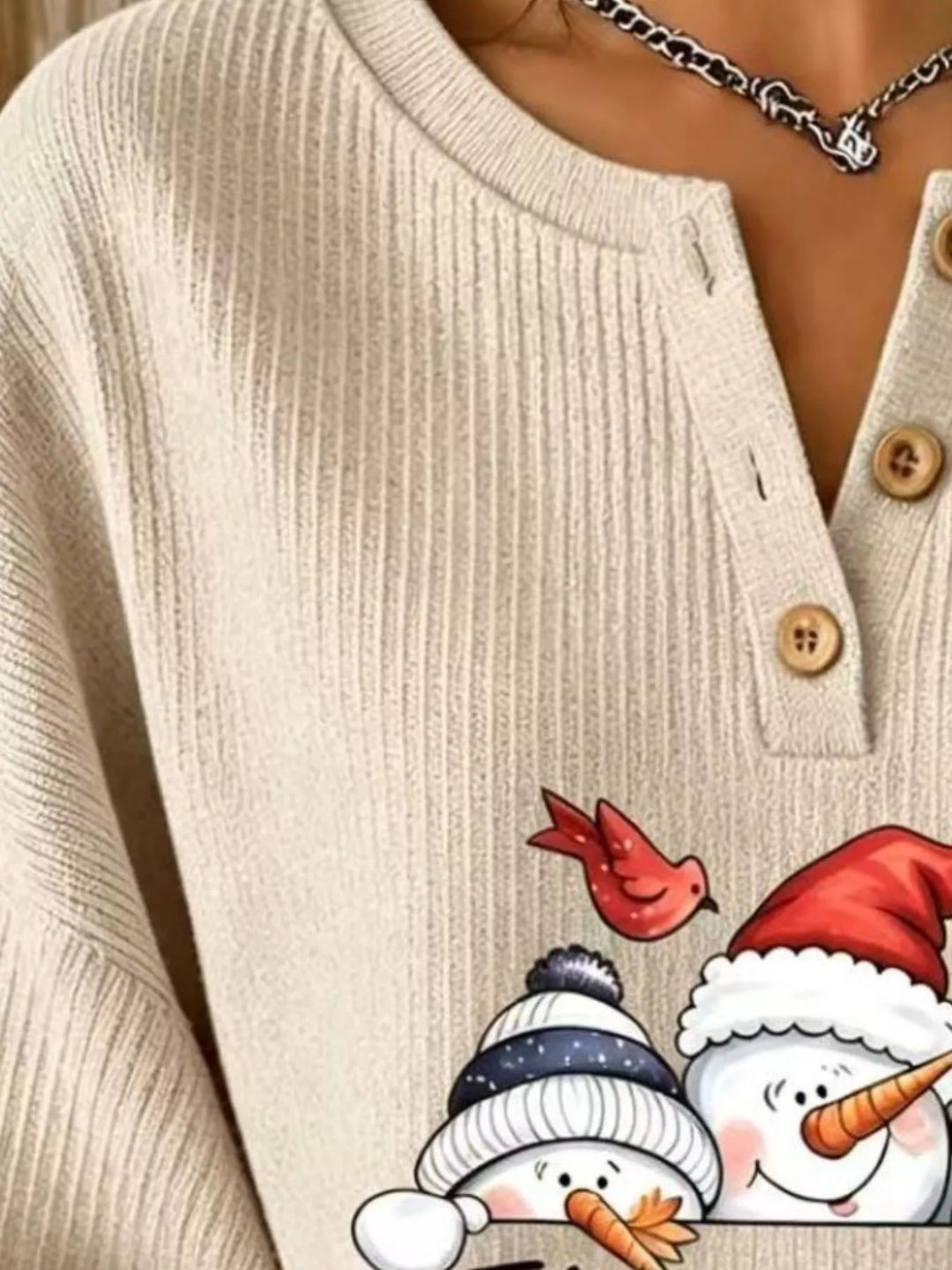 Snowman graphic henley placket in tan, close-up detail