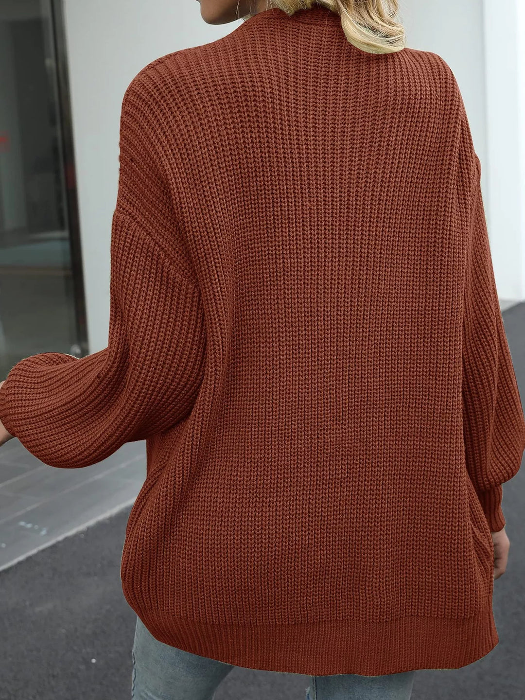 Back view of the rust chunky knit cardigan with a drop shoulder