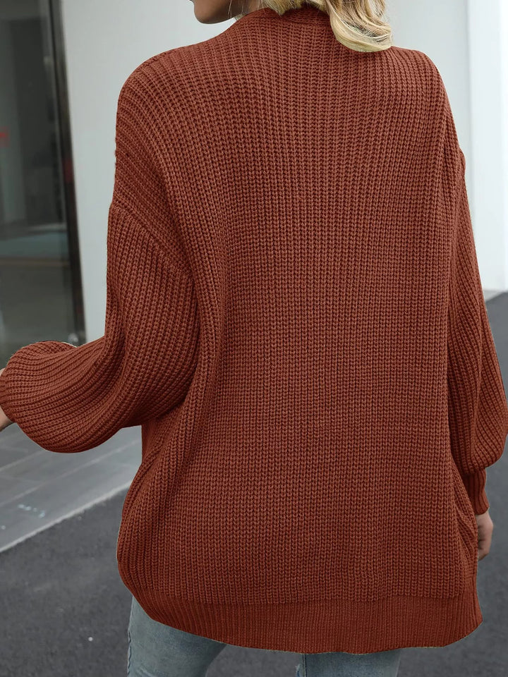 Back view of the rust chunky knit cardigan with a drop shoulder