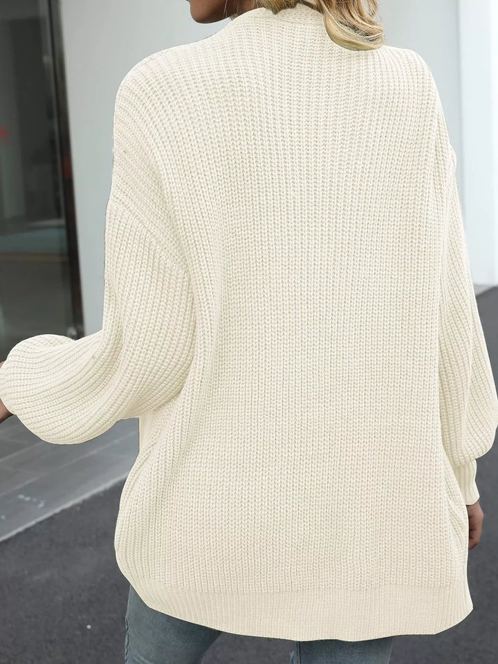Back view of the cream oversized chunky knit cardigan