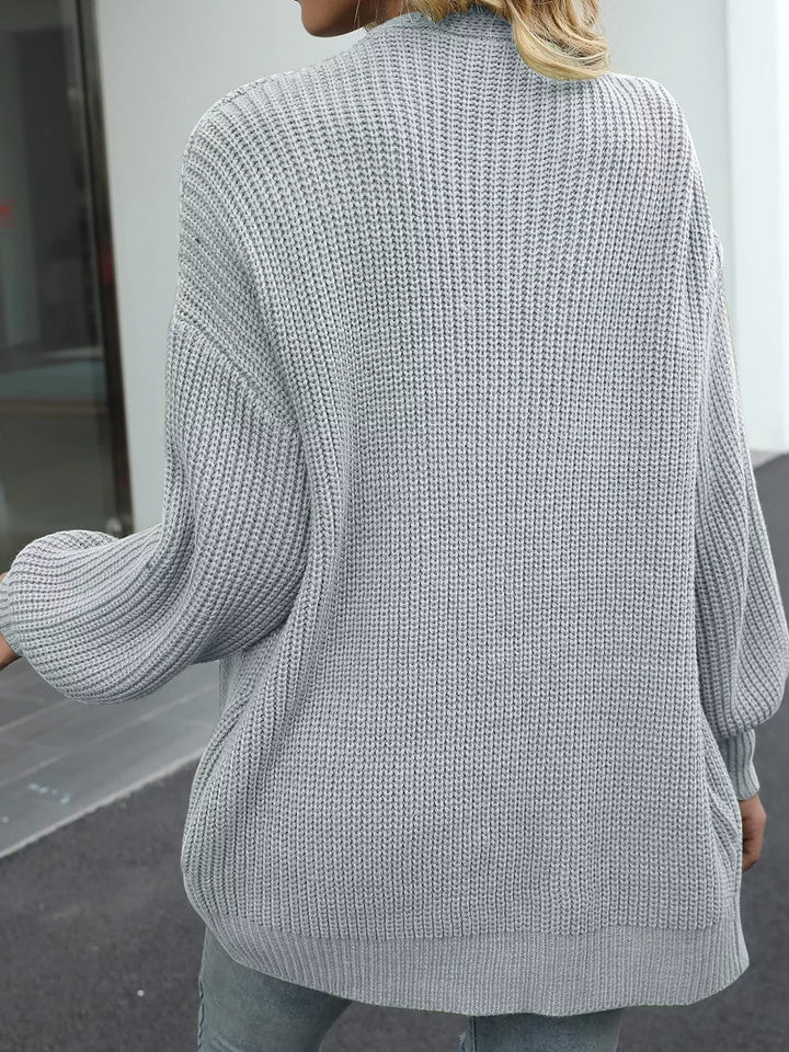 Back view of the light gray oversized chunky knit cardigan