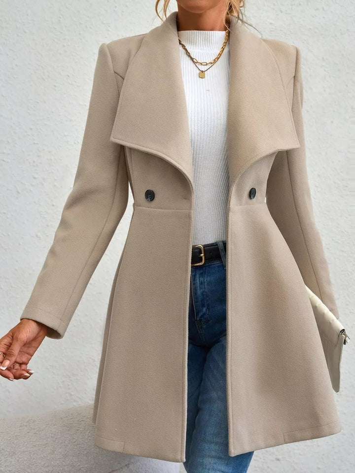 Women's coat in beige, fit and flare double breasted, front view with wide lapel
