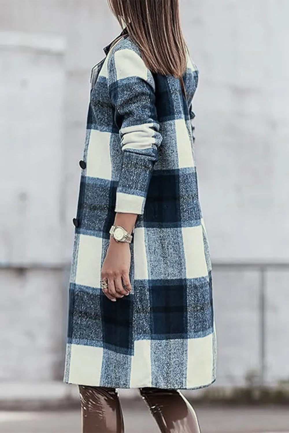 Navy plaid coat side view with the model facing away