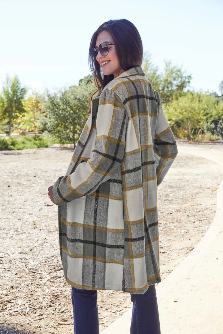Olive plaid coat side view showing the relaxed fit