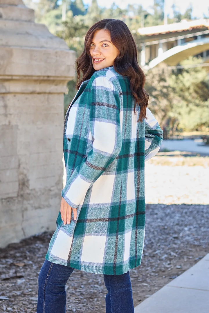 Teal plaid coat angled view showing the button front and pocket