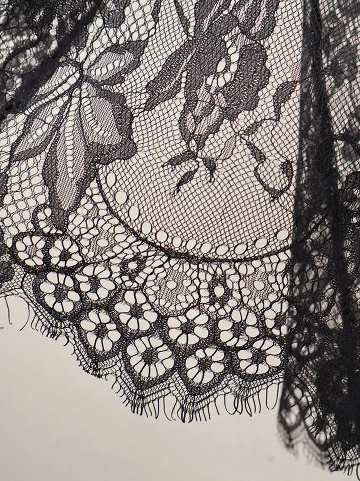 Close-up of the black eyelash lace scalloped edge on the overlay skirt