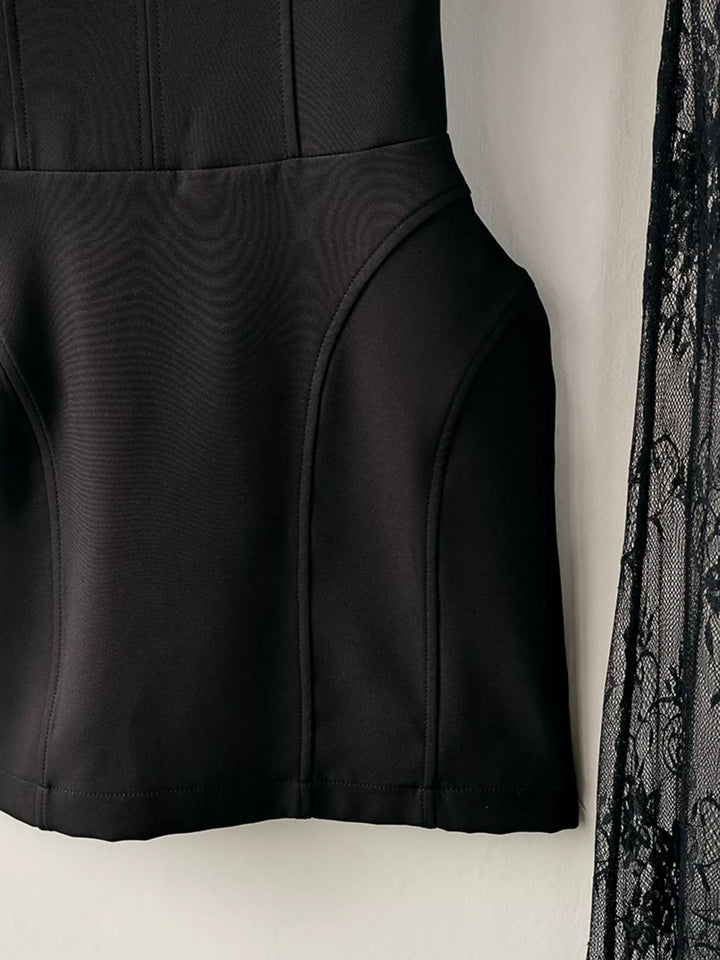 Side detail of the black mini skirt seams with lace overlay edge