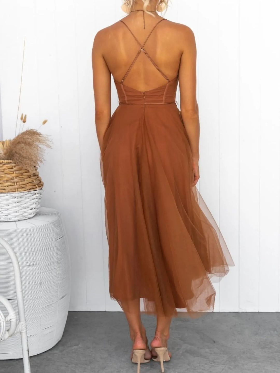 Caramel midi dress worn on a model, showing the layered tulle skirt