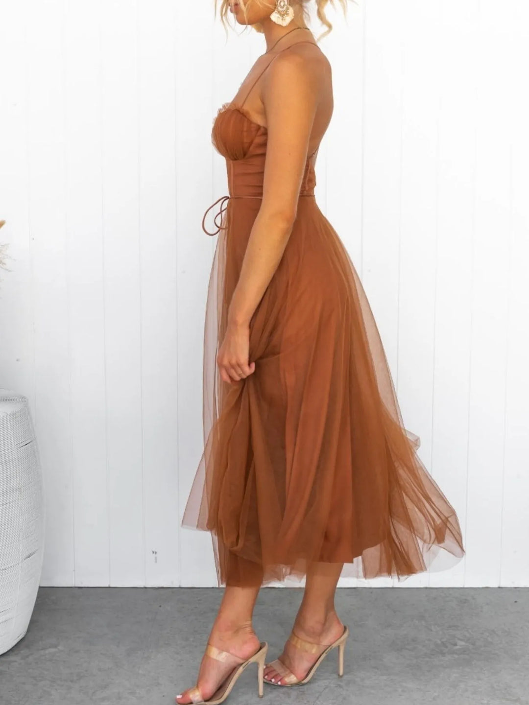 Caramel midi dress worn on a model, showing the thin straps