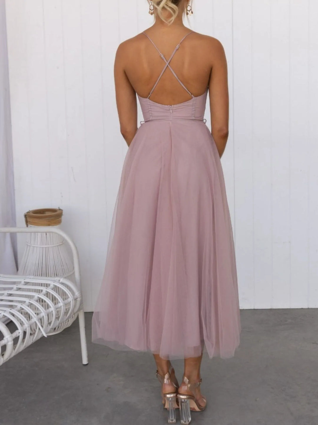 Pink midi dress worn on a model, showing the sweetheart neckline again