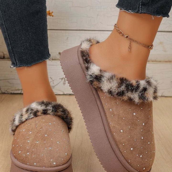 Taupe platform slippers with leopard trim worn with rolled jeans, side view