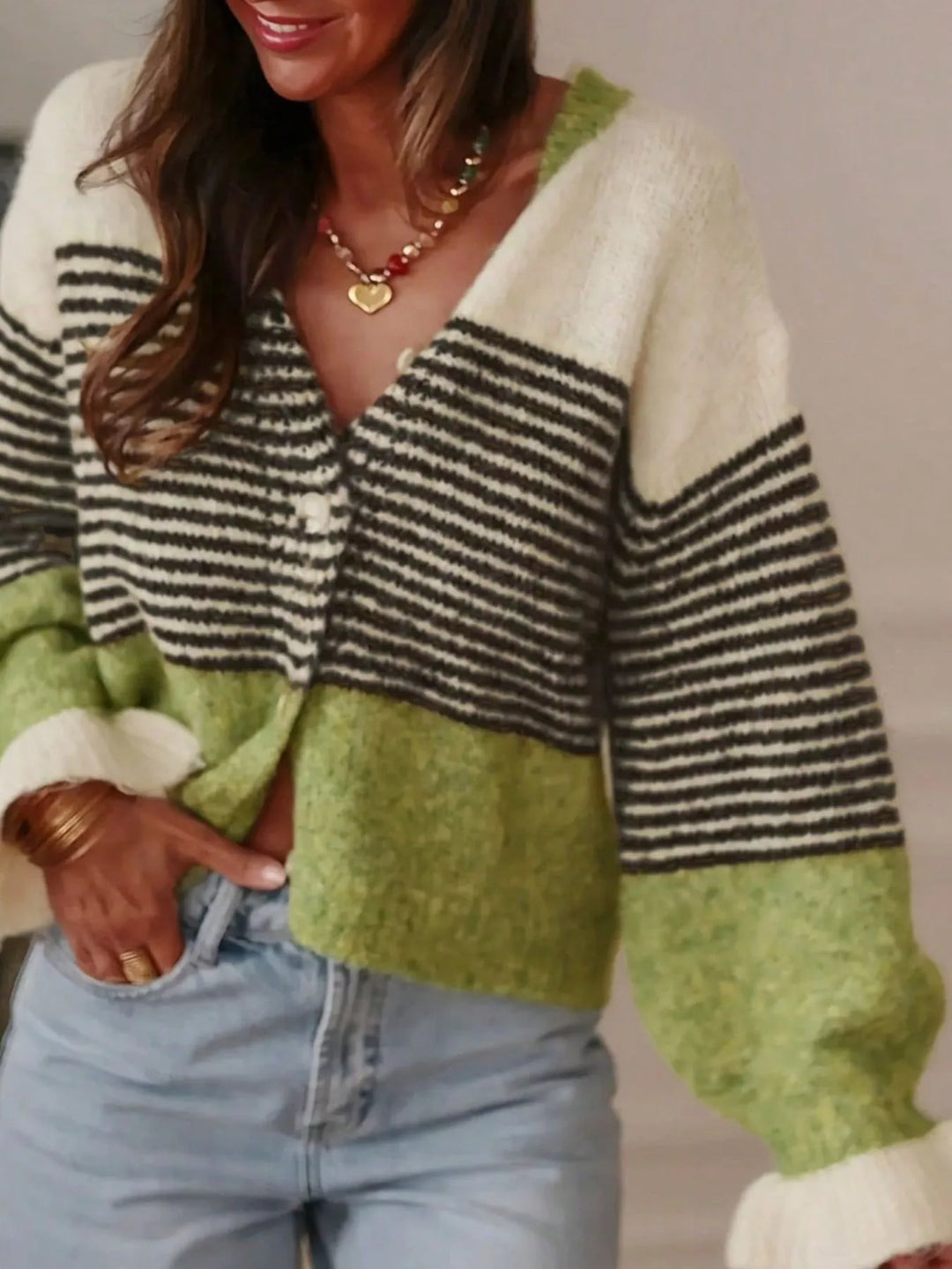 Green and black striped cardigan with V neck and cream sleeve cuffs