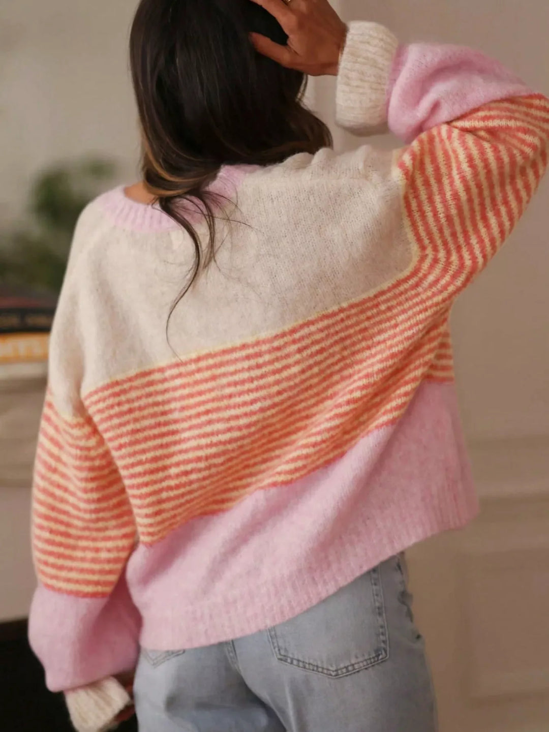 Back view of the pink and cream striped cardigan with balloon sleeves