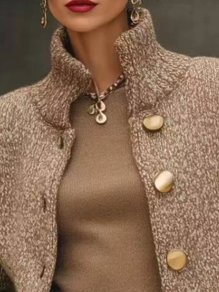 Close-up of the camel marled knit cardigan stand collar and buttons