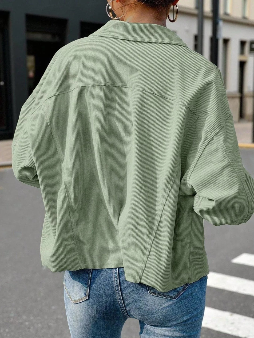 Back view of the sage green cropped jacket