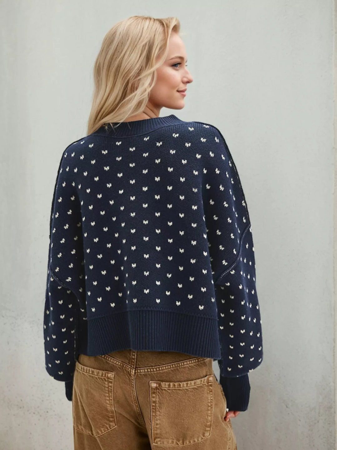 Back view of the navy heart pattern cropped sweater