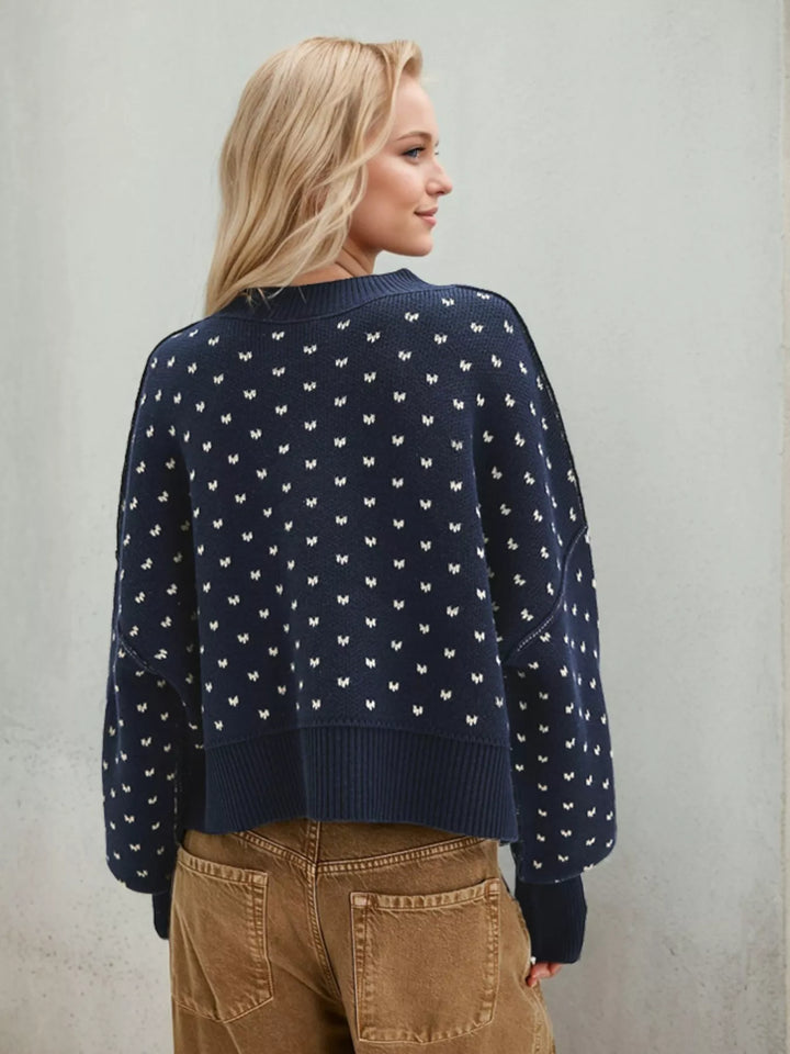 Back view of the navy heart pattern cropped sweater