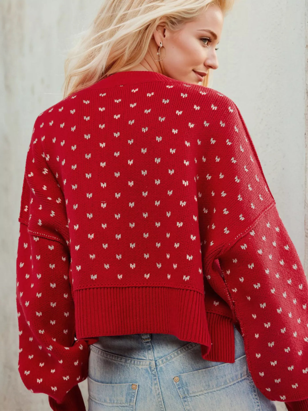 Back view of the red heart pattern sweater with ribbed hem