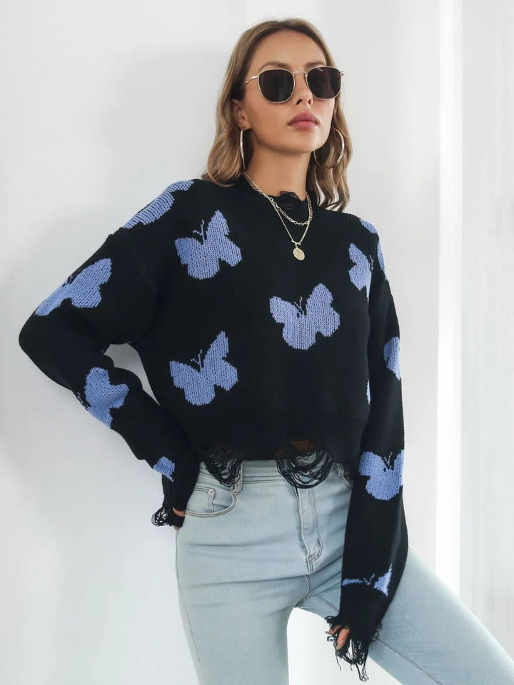 Black cropped sweater with light blue butterflies and distressed hem
