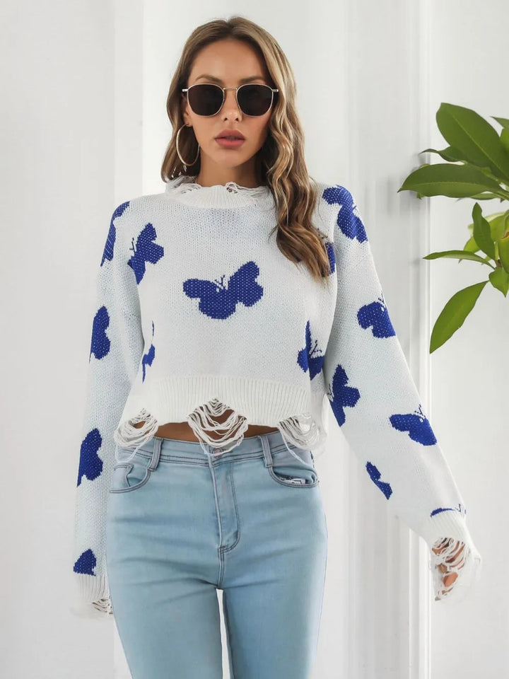 White cropped sweater with blue butterflies, standing front pose