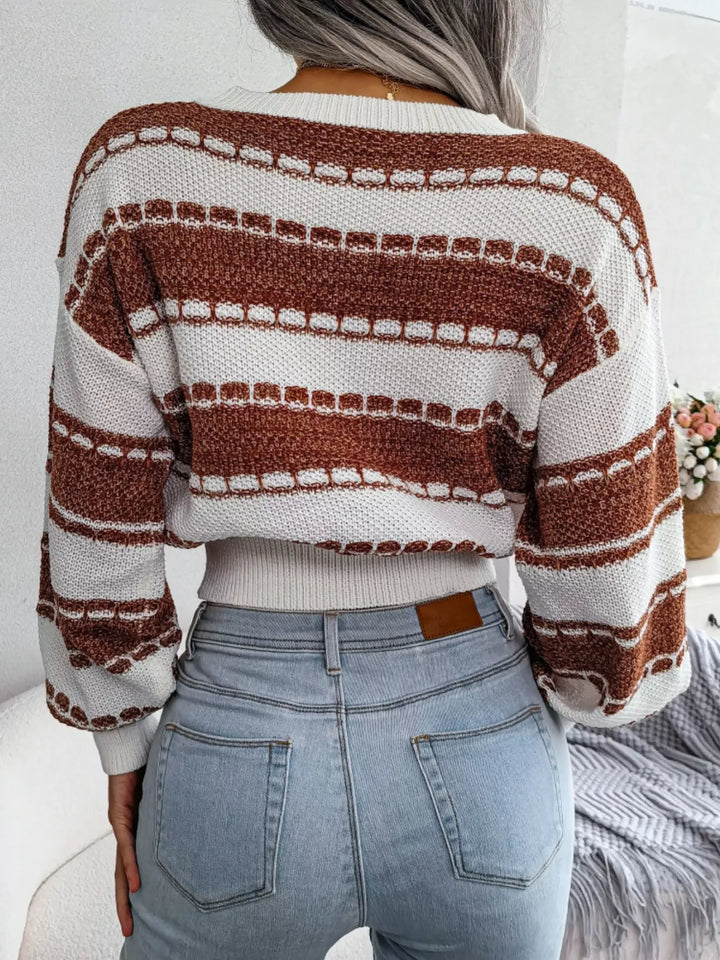 Back view of the rust striped cropped sweater with ribbed hem