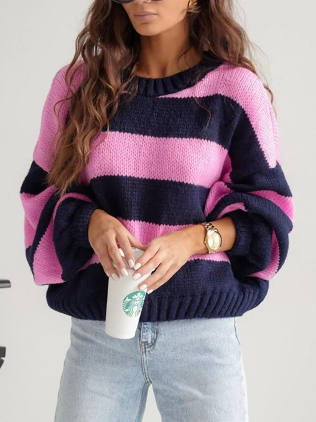 Pink navy striped cropped sweater styled with light wash jeans, three quarter view