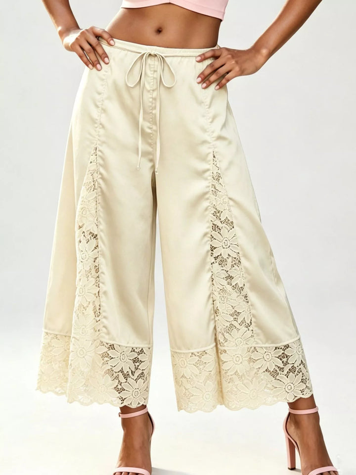 Champagne cropped wide leg pants with lace panels and tie waist, front view