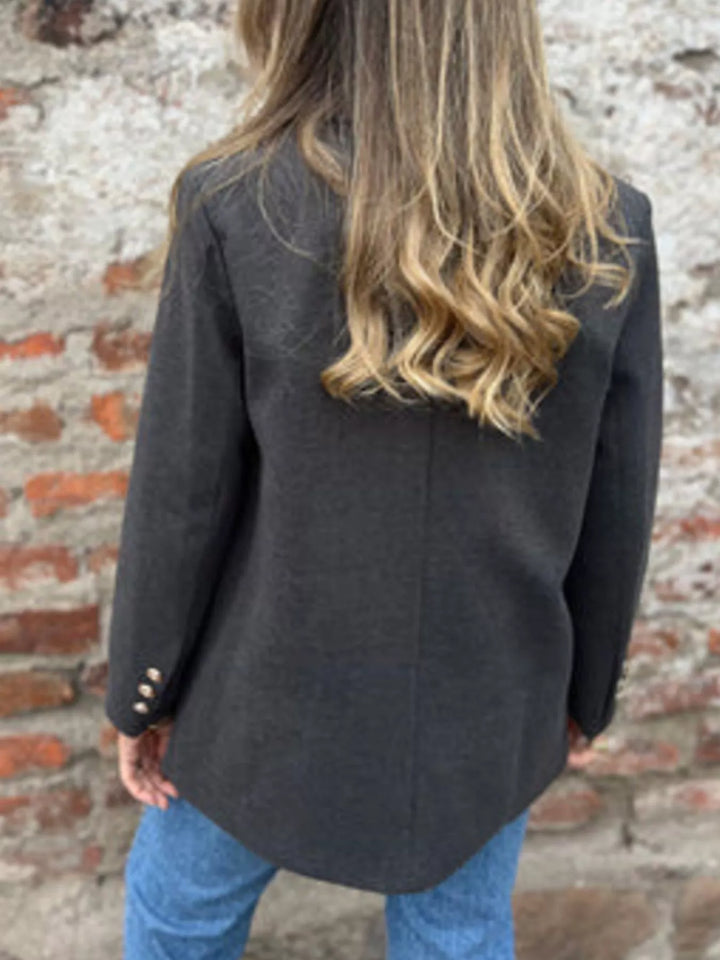 Back view of the charcoal relaxed double breasted blazer