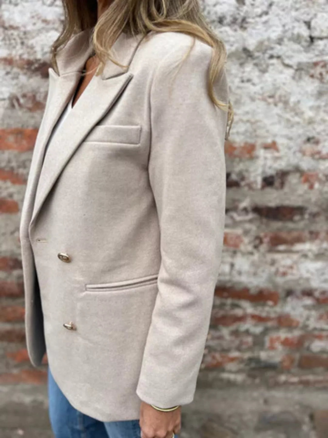 Oatmeal oversized blazer three quarter side view showing the chest pocket and lapel