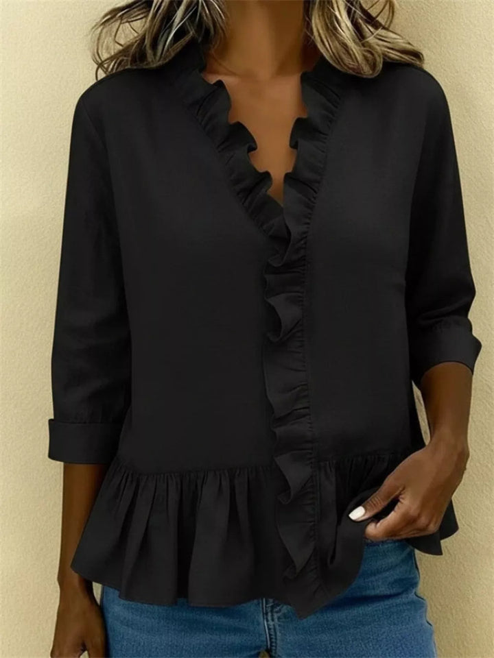 Ruffle front peplum hem relaxed v-neck in black, front view