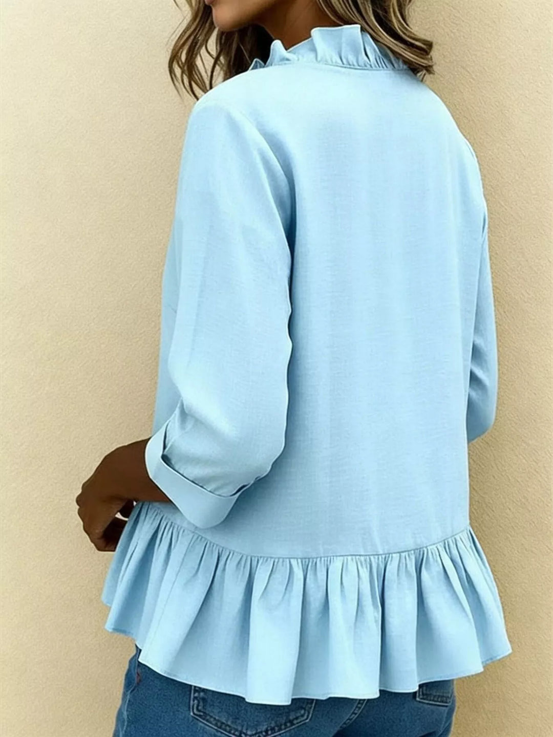 Ruffle front peplum hem relaxed v-neck in sky blue, back view