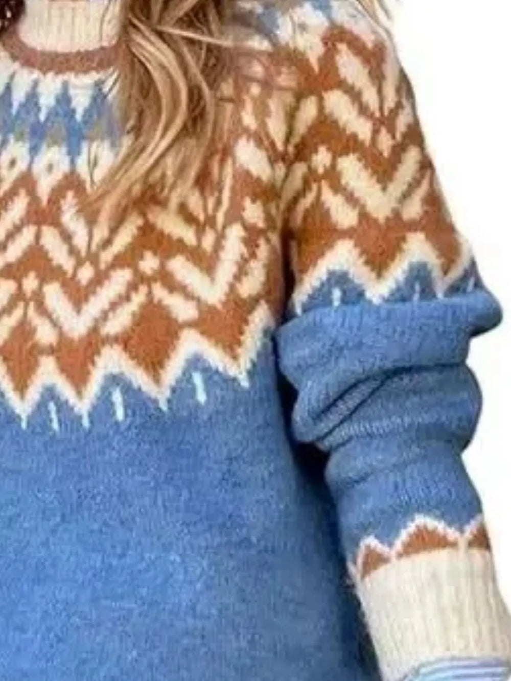 Close-up of the blue sweater zigzag yoke and striped cuff