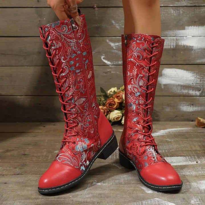 Red lace up boots front view with floral embroidery up the shaft