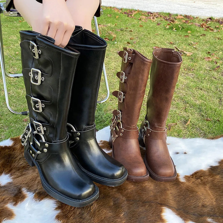 Women's fall boots in black and brown with mid calf height and moto buckle straps