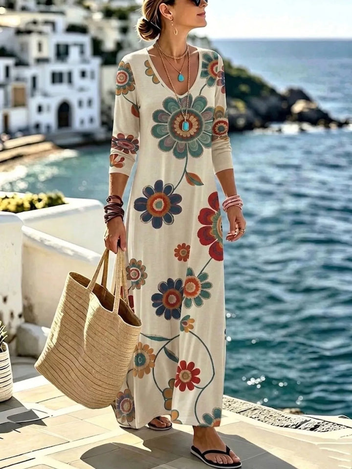 Beige maxi dress worn on a model, showing the long sleeves