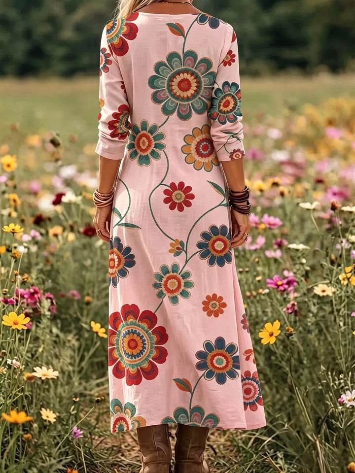 Dusty pink maxi dress worn on a model, showing the V-neck