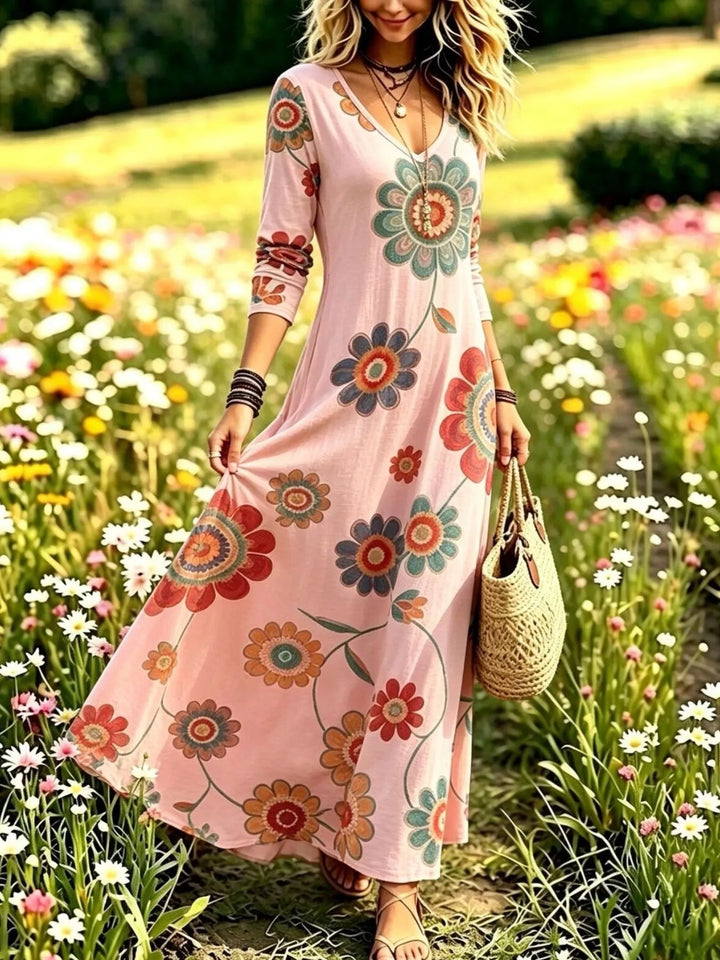 Dusty pink maxi dress worn on a model, showing the long sleeves