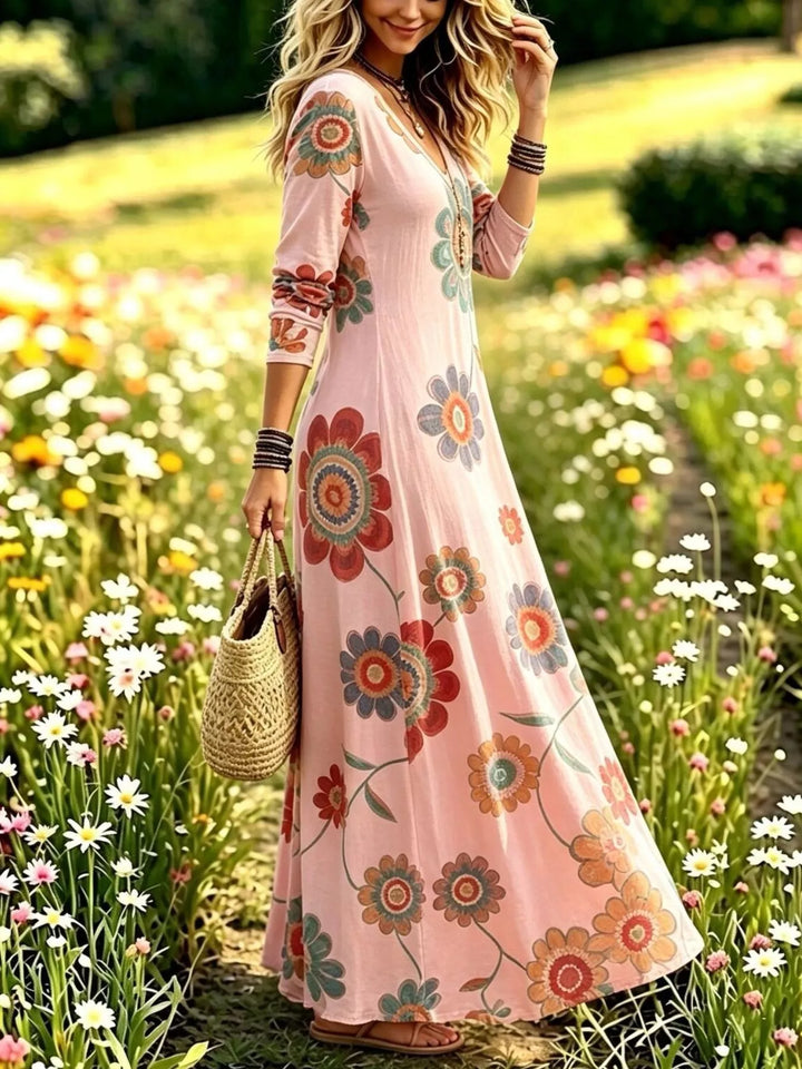 Dusty pink maxi dress worn on a model, showing the flowing maxi skirt