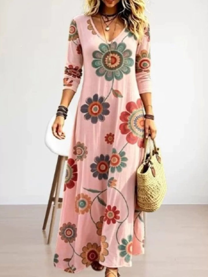 Dusty pink maxi dress worn on a model, showing the medallion floral print again