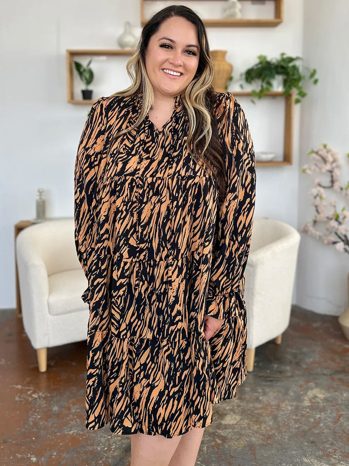 Caramel mini dress worn on a model, showing the relaxed fit again